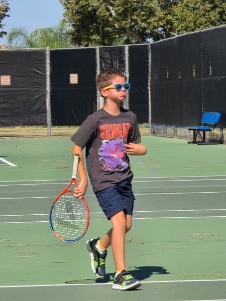Young player in sunglasses