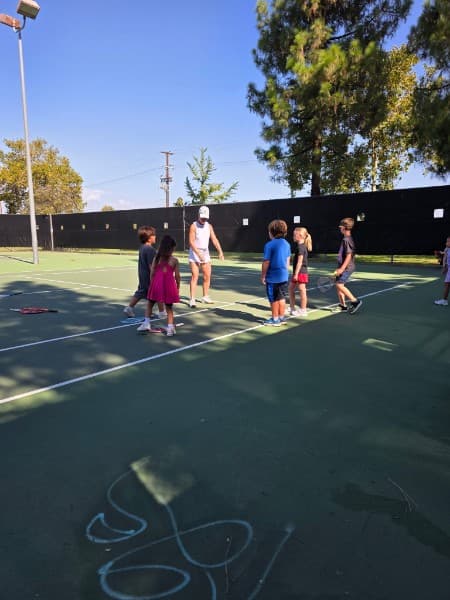 Group clinic on a blacktop court